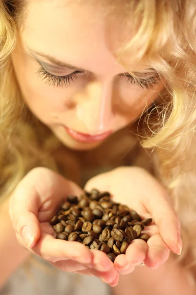 Holding in hands coffee beans — Stock Photo, Image
