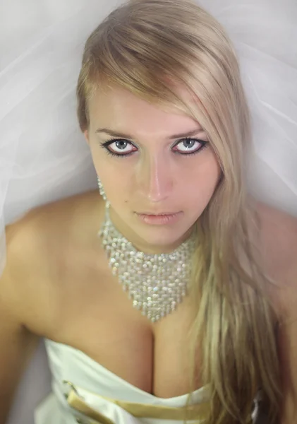 Beautiful blond girl in a wedding dress — Stock Photo, Image