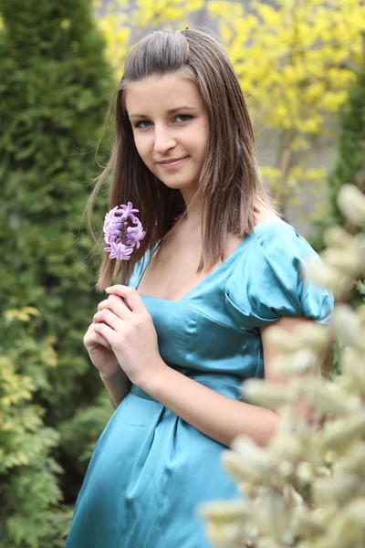 Young girl with hyacinth — Stock Photo, Image