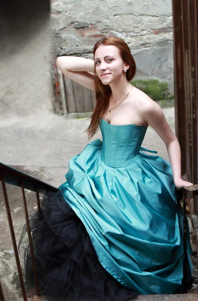 Red haired girl in the beautiful blue dress — Stock Photo, Image