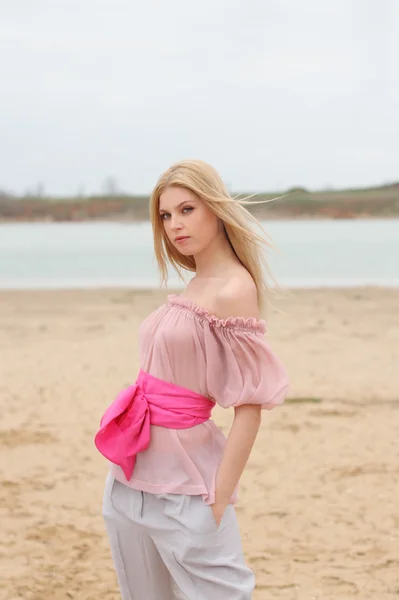 Beautiful blond girl near the river Royalty Free Stock Images