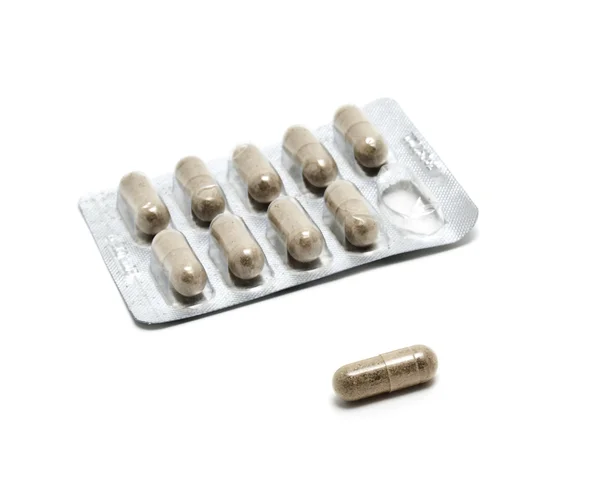 Suplemento a base de hierbas píldoras en embalaje —  Fotos de Stock