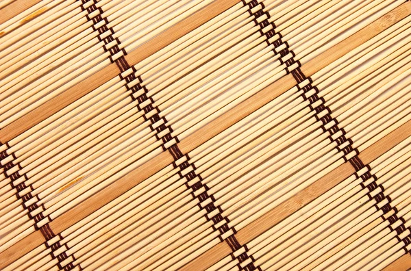 Achtergrond in de vorm van een stro mat — Stockfoto