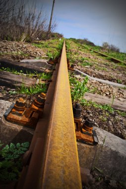 Rusty rail - the railway leaving afar clipart