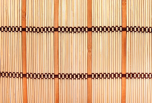 Achtergrond in de vorm van een stro mat — Stockfoto
