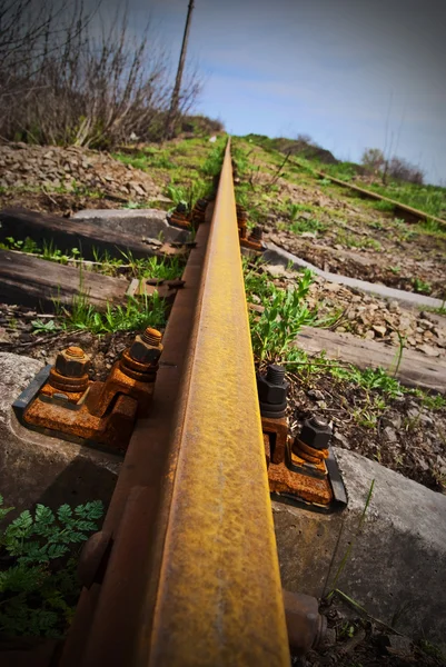stock image Rusty rail - the railway leaving afar