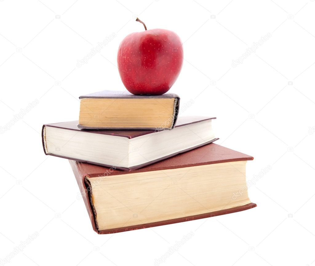 The thick books and apple