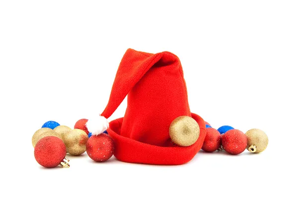 Röd mössa och julgran dekor — Stockfoto