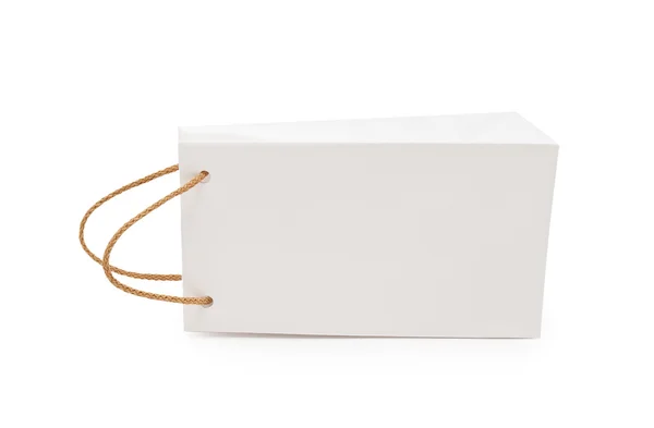 Pacchetto regalo bianco su sfondo bianco — Foto Stock