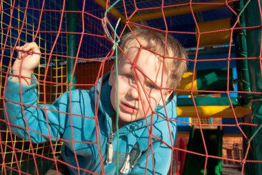 One little boy behind bars clipart