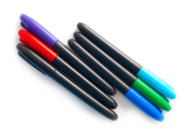 Set of multi-coloured pens on a white background clipart