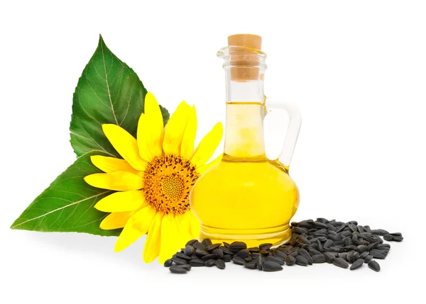 Kleine Flasche mit Sonnenblumenöl und Sonnenblumenkernen — Stockfoto