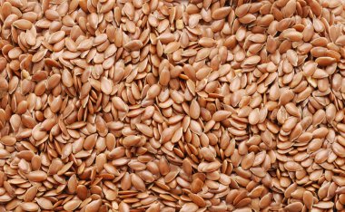 Natural background of flax seeds clipart