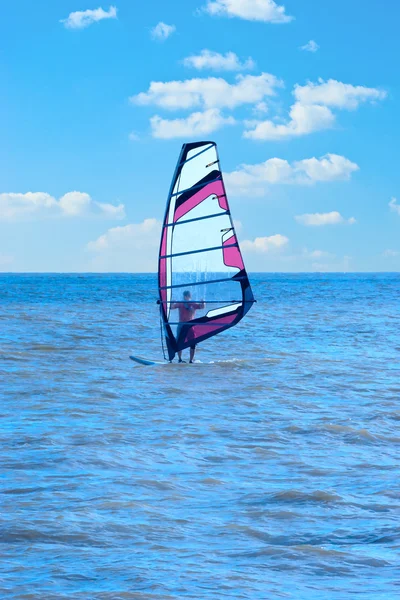 stock image The man who is engaged in windsurfing