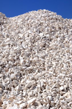 Pile of quarry stone for building sorted according to size clipart