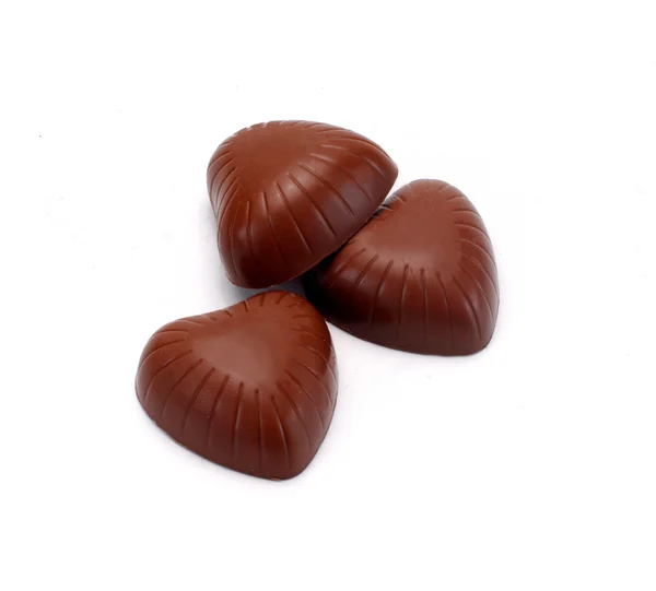 Doces de chocolate em um fundo branco — Fotografia de Stock