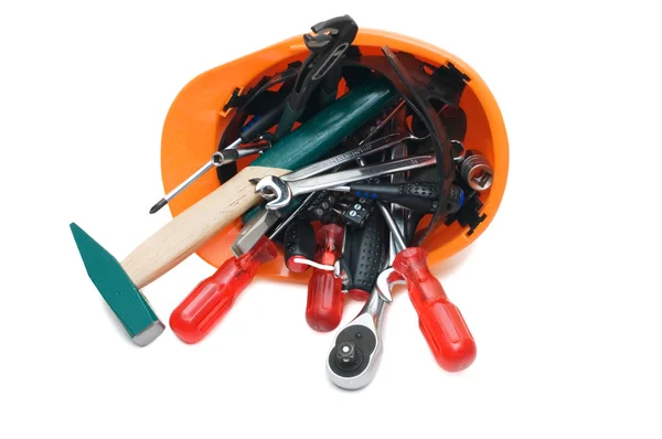 Gebouw tools in een oranje helm — Stockfoto