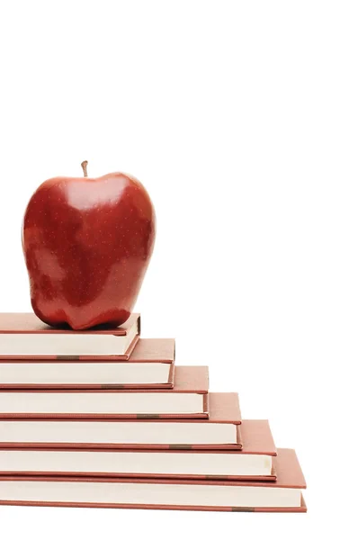 Montón de libros y manzanas aisladas — Foto de Stock