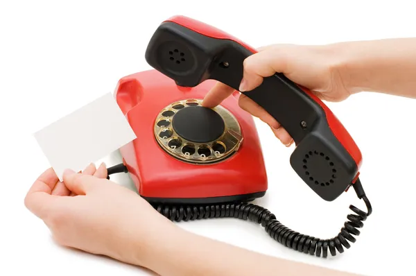 The girl dials number on red phone — Stock Photo, Image
