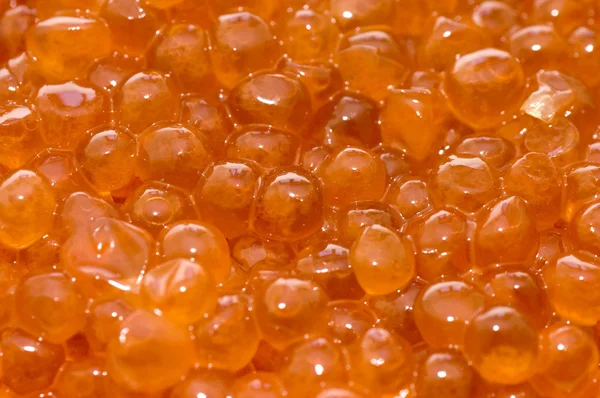 Nahaufnahme von rotem Kaviar Hintergrund — Stockfoto