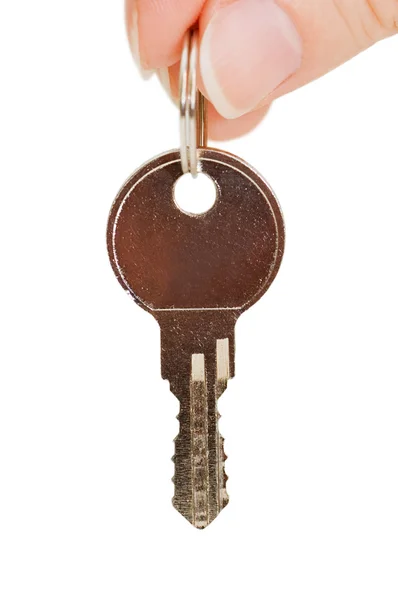 Anahtar üzerinde beyaz izole bir el — Stok fotoğraf