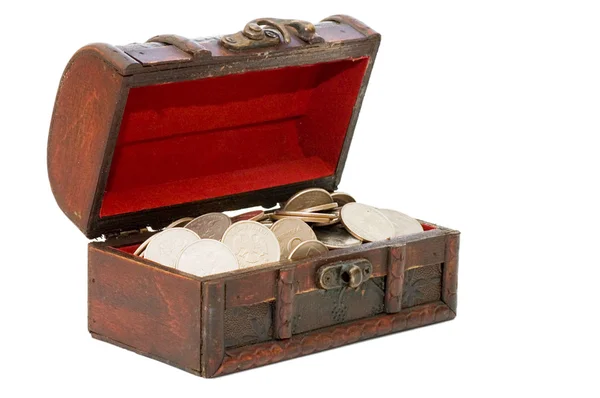 Wooden casket full of coins isolated — Stock Photo, Image