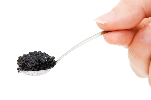 Caviar preto em uma colher isolada — Fotografia de Stock