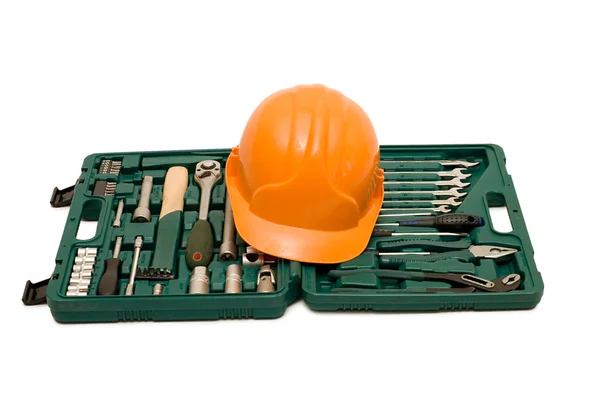 Vak voor tools een helm geïsoleerd — Stockfoto