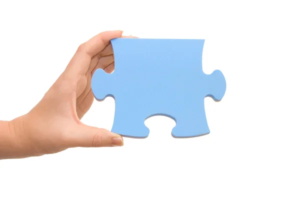 Hand en puzzel geïsoleerd op wit — Stockfoto