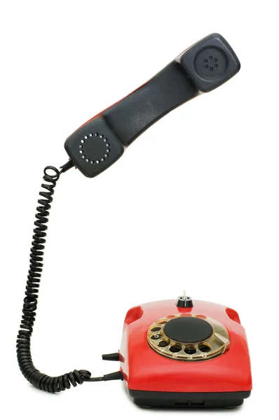 Teléfono viejo rojo aislado en blanco — Foto de Stock