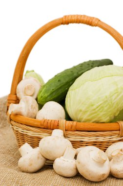 Wattled basket with vegetables isolated clipart