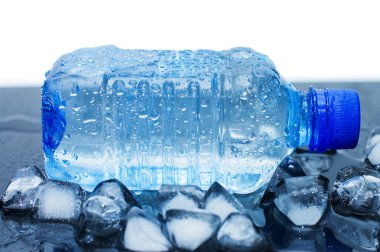 Cold water bottle with ice cubes clipart