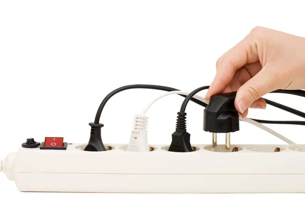 Hand with an electric plug — Stock Photo, Image