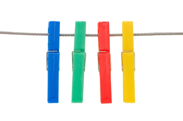 Clothespins hang on a cord — Stock Photo, Image