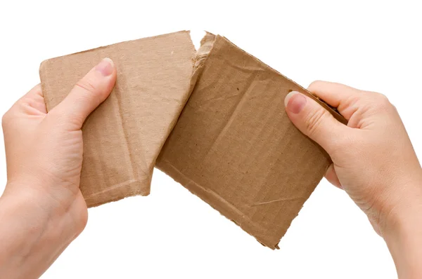 Hands tear the cardboard tablet — Stock Photo, Image