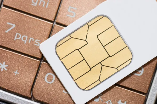 Celular e cartão SIM — Fotografia de Stock