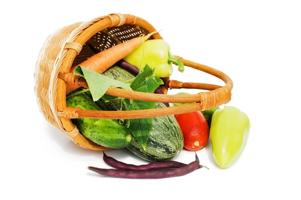 Wattled basket with vegetables isolated on white — Stock Photo, Image
