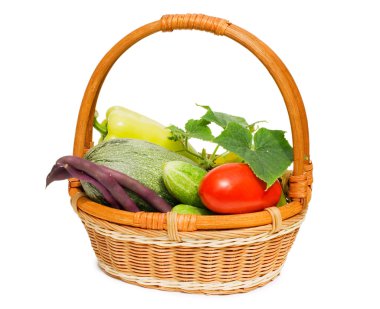 Wattled basket with vegetables isolated on white clipart