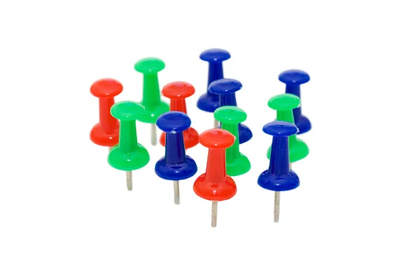 Colorful push pins arranged on white background — Stock Photo, Image