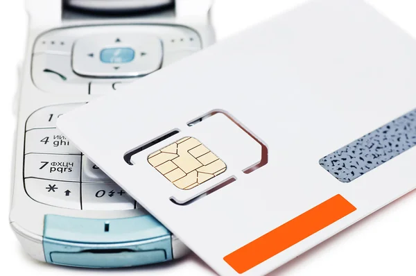 Celular e cartão SIM isolado no fundo branco — Fotografia de Stock