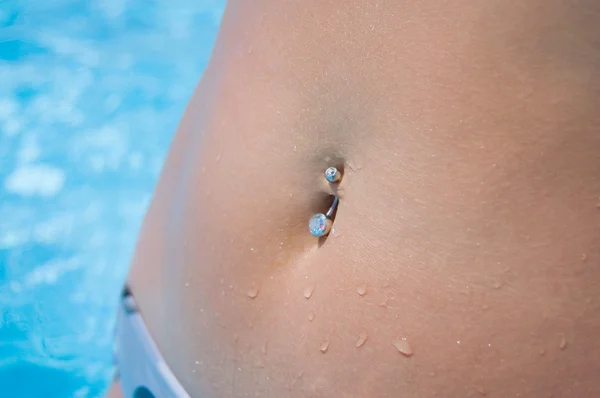 stock image Piercing in a stomach at the girl