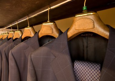 Hanging designer suits clipart