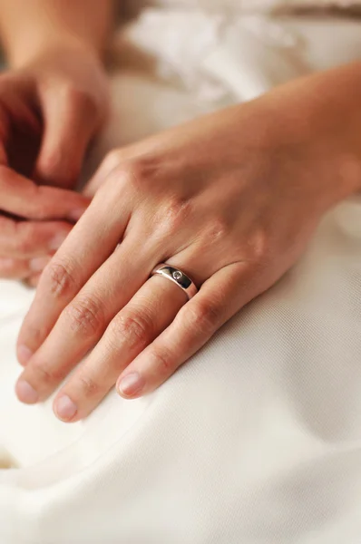 Bride wearing wedding ring — Stock Photo, Image