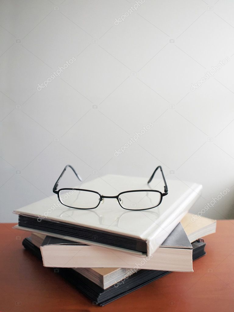Glasses on books