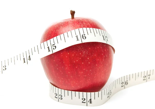 Красное яблоко с лентой — стоковое фото