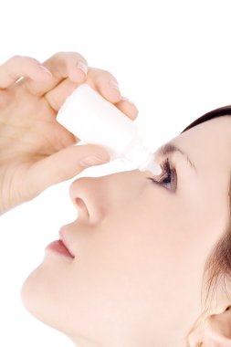 Woman dripping eye with eyes drops clipart