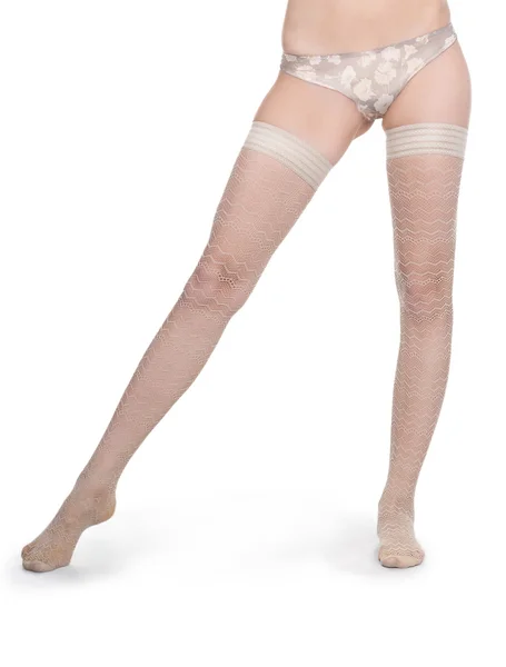 Schöne Frau Beine in weißen Strümpfen — Stockfoto