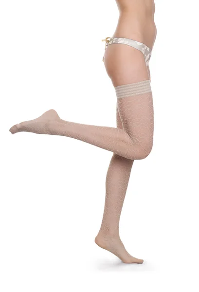 Beautiful woman legs in white stockings — Stock Photo, Image