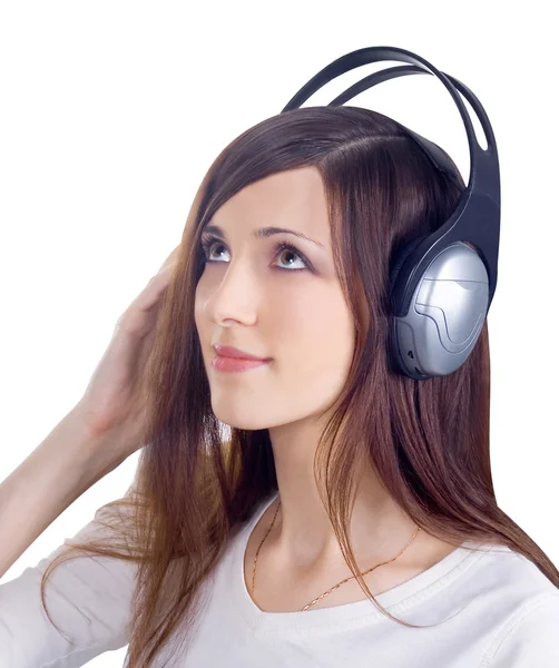 Giovane donna in cuffia ascoltare musica — Foto Stock