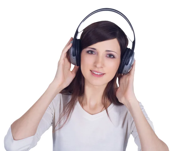 Giovane donna in cuffia ascoltare musica — Foto Stock